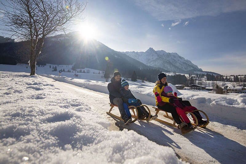 Rodeln Schlittenfahren Walchsee Winter Familie